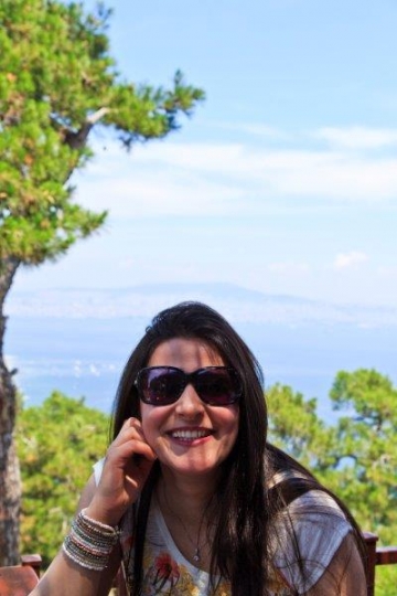 woman on a holiday smiling to the camera