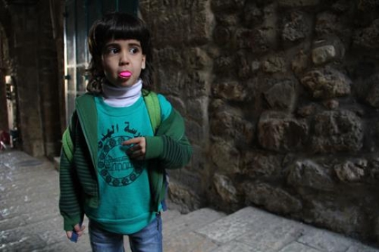 a Boy chewing gum in old stairs