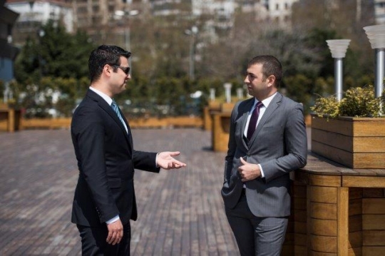 Two Turkish Businessmen Discus