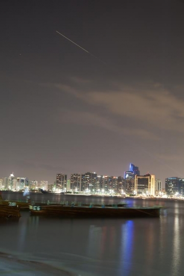 shooting star in city sky