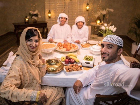 father taking selfie with family|-