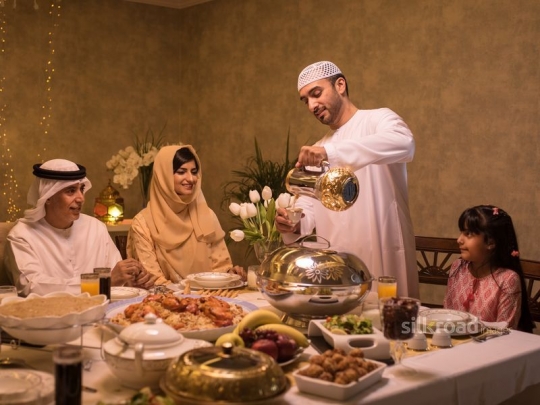 Father serving Arabic coffee|-