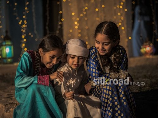 Kids celebrating with glowing matches|-