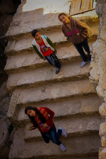 Inside of Ajloun fortress. three gils looking to camera