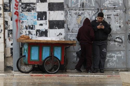 young man holding phone