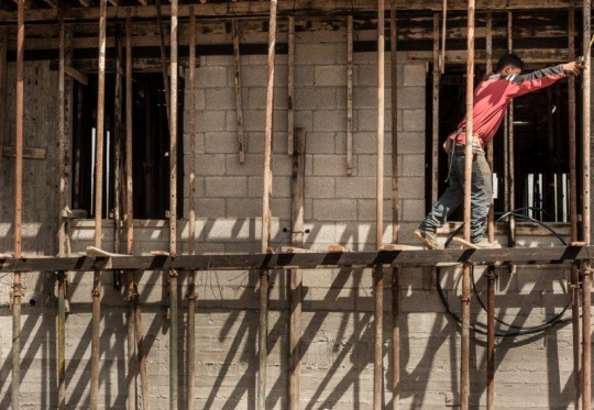 Construction worker on scaffold 