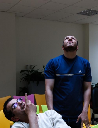 two men looking up to the ceiling