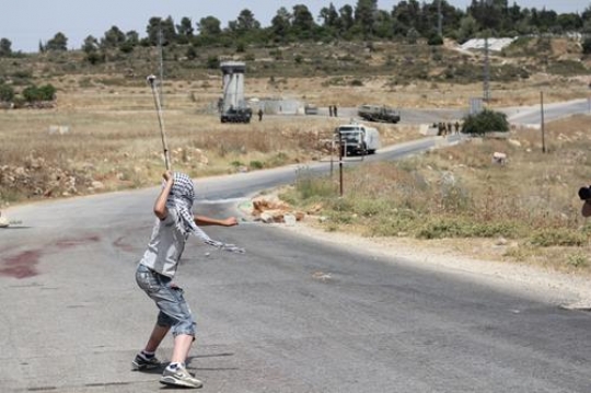 Masked Palestinian boy Resist Israeli occupation