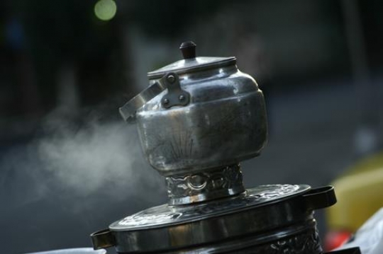 old aluminum kettle steaming