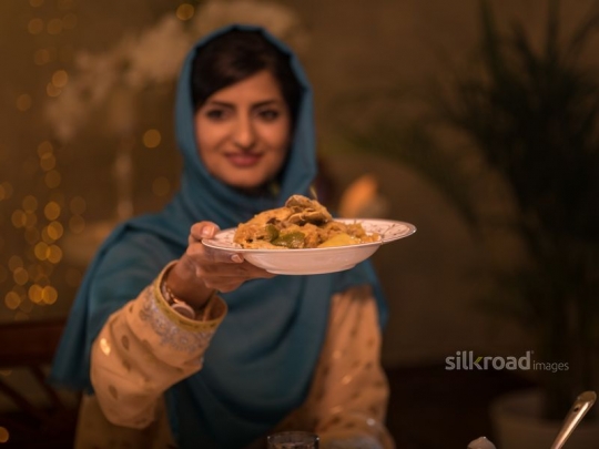 Woman taking meal|-