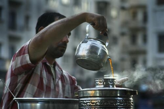man pours tea in jordan