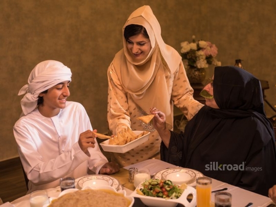 Mother serving puff pastry|-