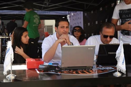 man sitting with his laptop computer in front of him