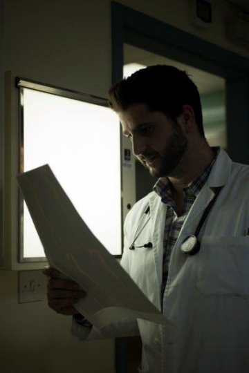 Doctor Checking X-Ray Results