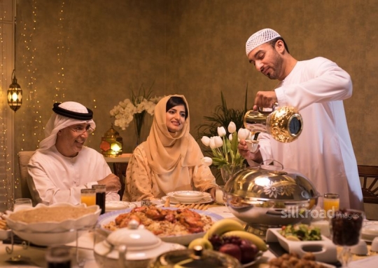 Man serving arabic coffee|-