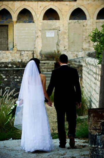 bride and groom holding hands standing in wadi salib