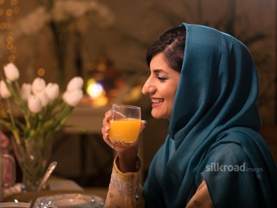 Woman drinking juice|-