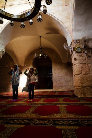 Two muslim girls praying
