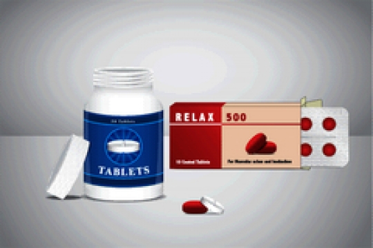 pill bottle with pack of pills on gray background