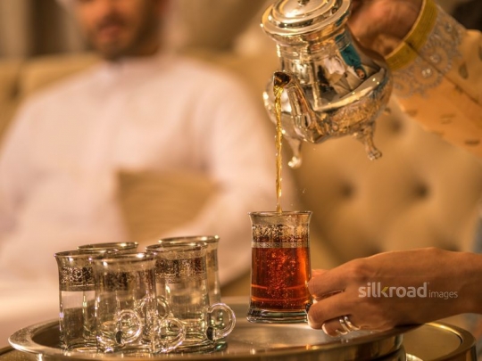 Serving Arabic tea|-