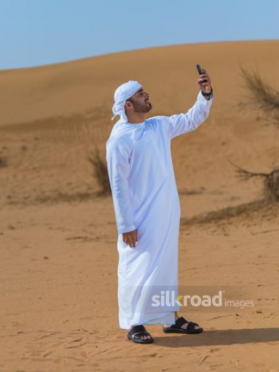 Man checking mobile phone