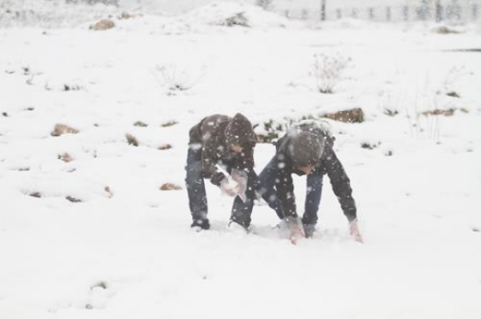 Fresh snow cover, at winter in Palestine, everbody happy and outside and play in the snow
