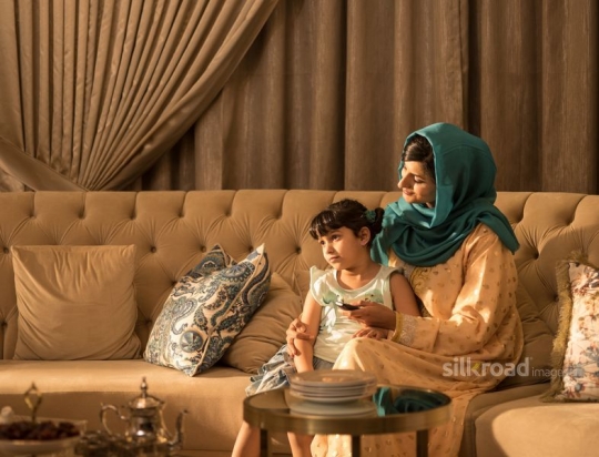 Mother and daughter in TV room|-