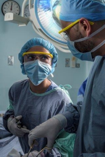 Surgeons Running an Operation