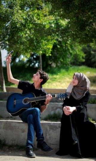 Palestinian Youth Playing Guitar