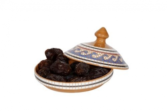 Dried Dates Inside A Pottery Plate