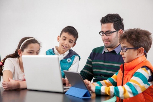 Kids and Teachers at Computer 