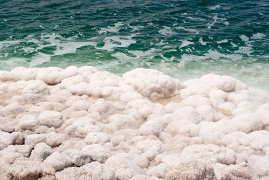 Crystalic salt on a rocks near beach in the Dead Sea, Jordan