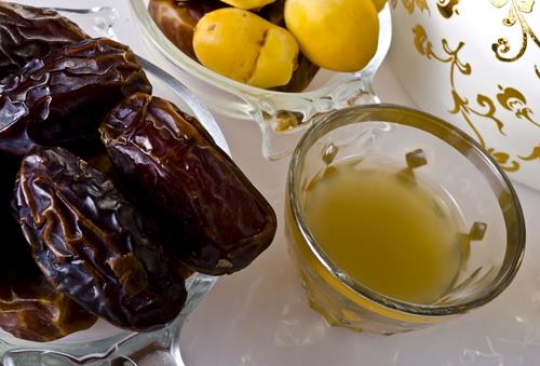 cup of coffee and dates in a bowl