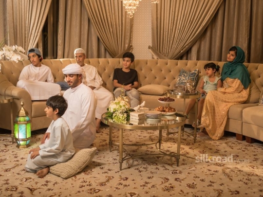 -Family gathered around TV|-