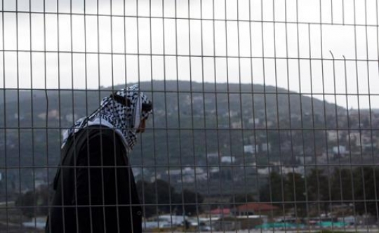 Man behind the barrier mesh