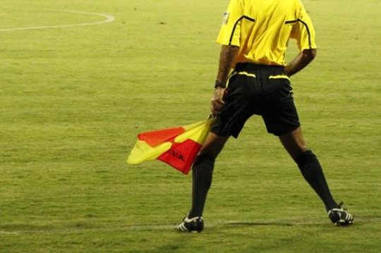 Referee with his red and yello