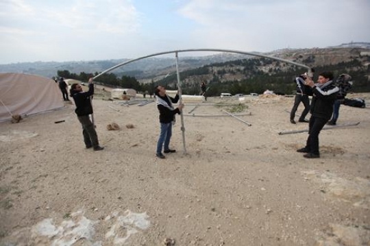 Palestinian demonstrators setting up tents at Bab al-Shams or Gate of the Sun in Arabic, in a bid to draw attention to Israeli plans to boost settlement building in the West Bank area.