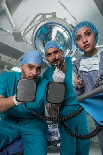 Surgeons Holding Electric Card
