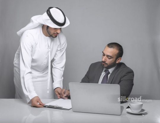 Manager signing papers