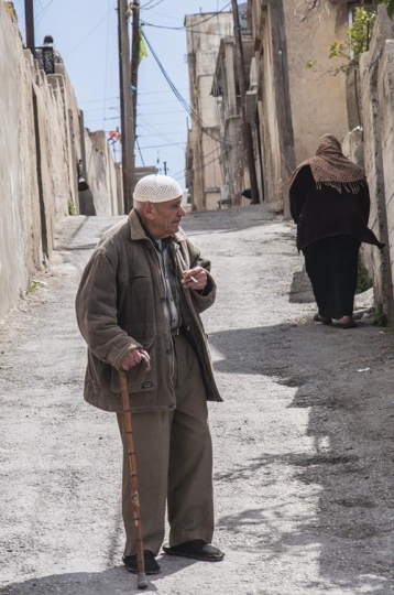 an old man with cane and cigar