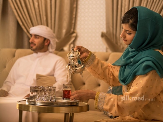 Wife serving Arabic tea|-