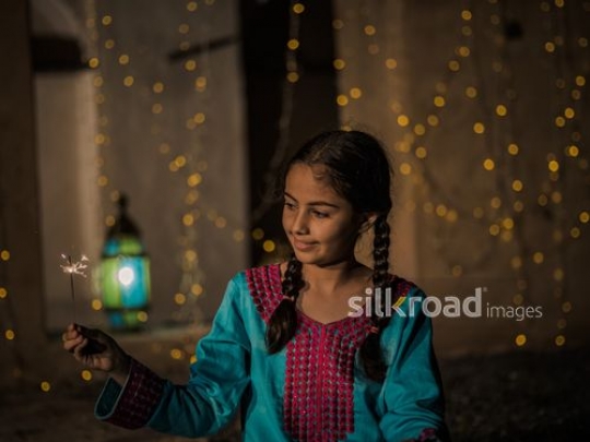 Girl playing with fiery matches|-