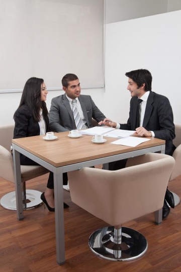 business people sitting at tab