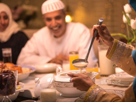 Mom serving mushroom soup|-