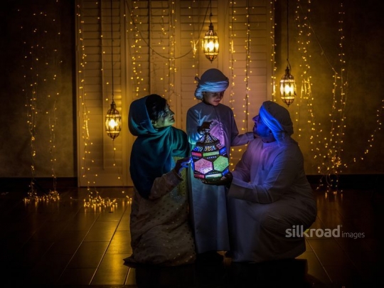 Parents wit son celebrating ramadan|-