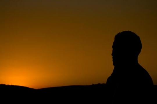 silhouette of a man at sunset