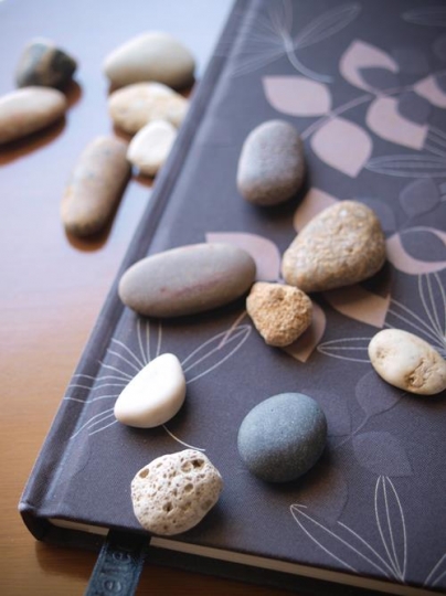 Colored stones and notebook