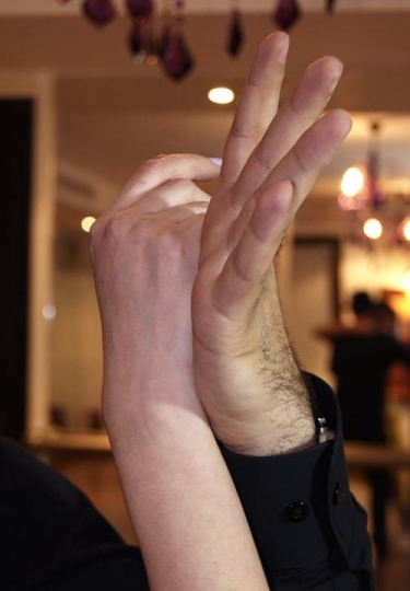 couple dancing with hands clasped