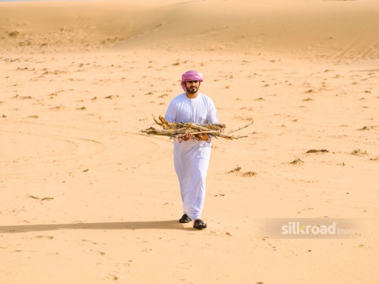 Man carrying dry branches