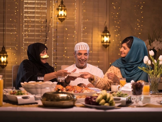 Daughter serving mother meal|-